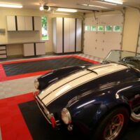 double parking in a garage with black grey and red floor tiles