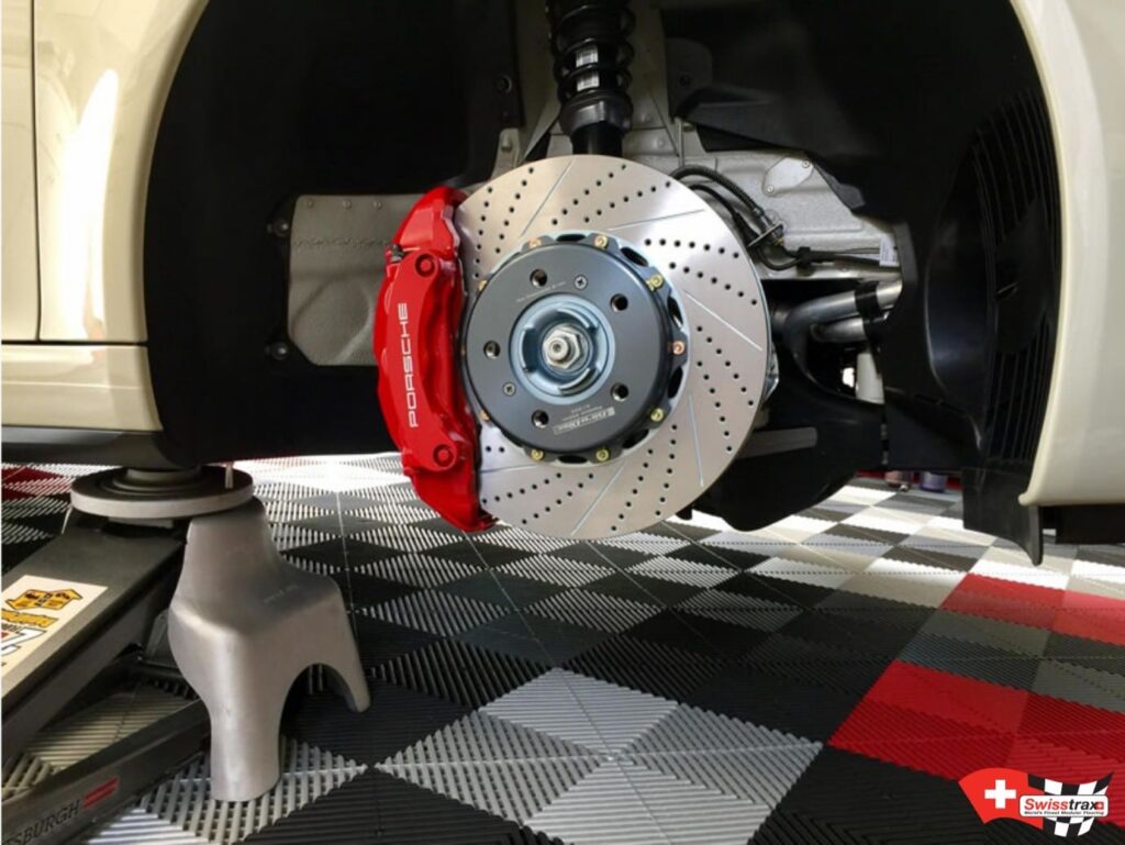 race paddock floor tiles, with a Porsche brake system