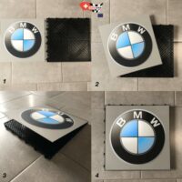 installation d'un logo interchangeable BMW sur une dalle clipsable