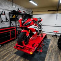 Wood-grain Vinyltrax in a motorcycle workshop