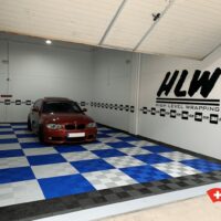 workshop flooring in silver grey and royal blue with swisstrax tiles