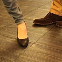 dancers on a parquet finish modular flooring