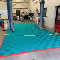 worshop floor with a car lift