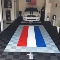 Garage floor with flag design and the Mustang logo
