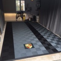 swisstrax garage floor, porsche logo on epoxy base